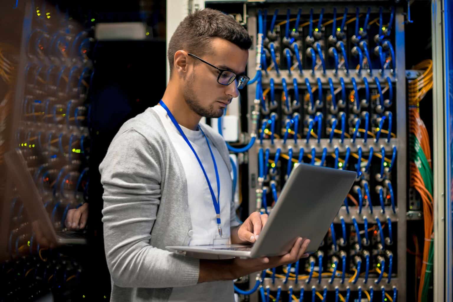 A technician working on a laptop