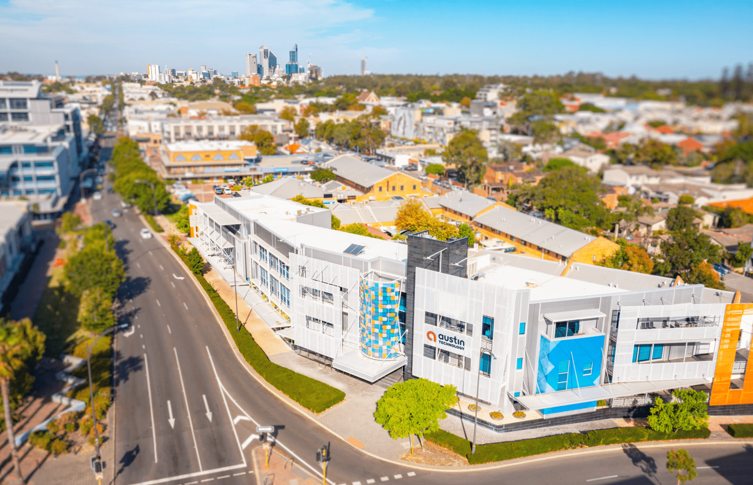 Austin Technology office building on Hay Street, Subiaco, with the Perth skyline behind