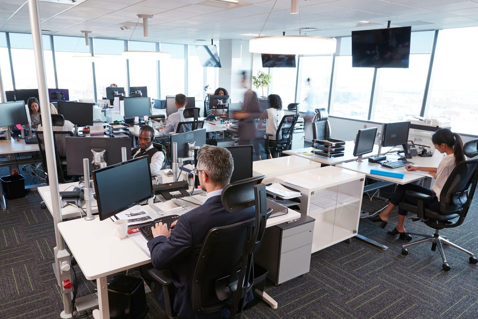 A team working at laptops in an office