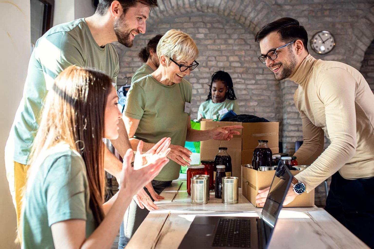Volunteers packing donations at a community centre