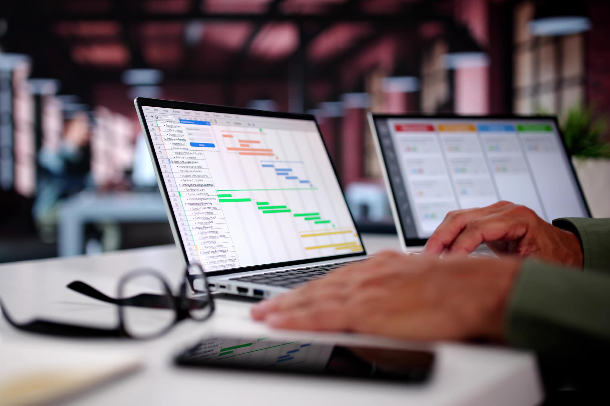 Accountant working through client spreadsheets on a laptop