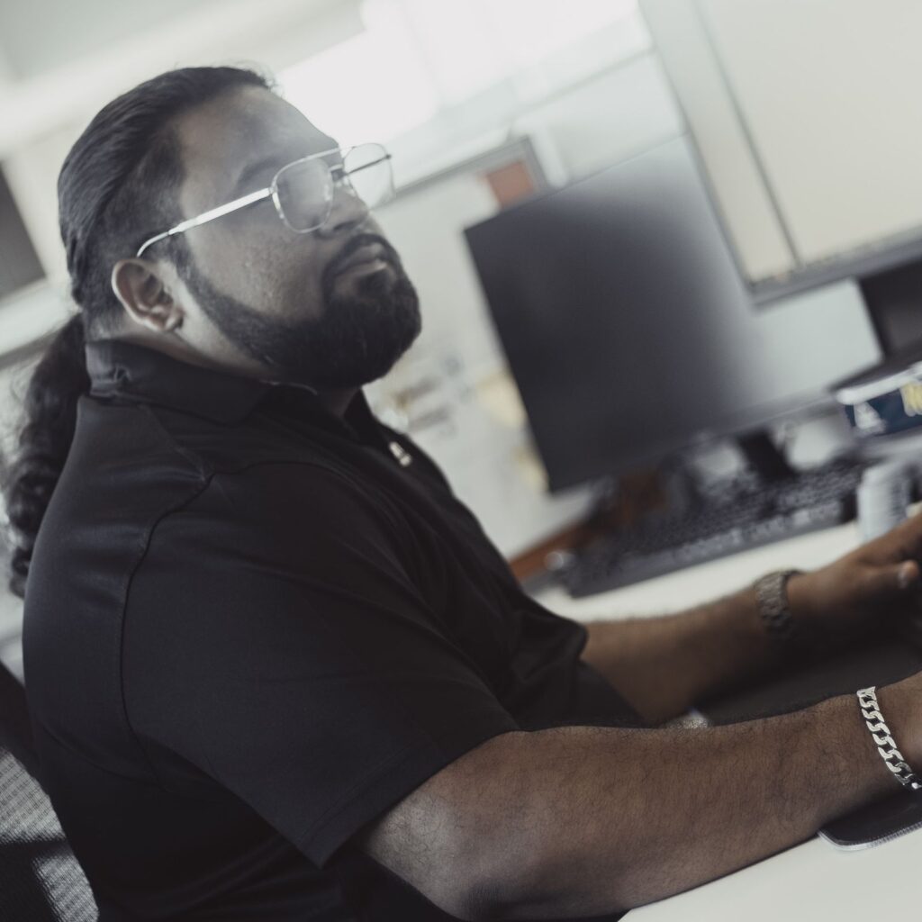 An Austin Technology security engineer reviewing alerts at his desk