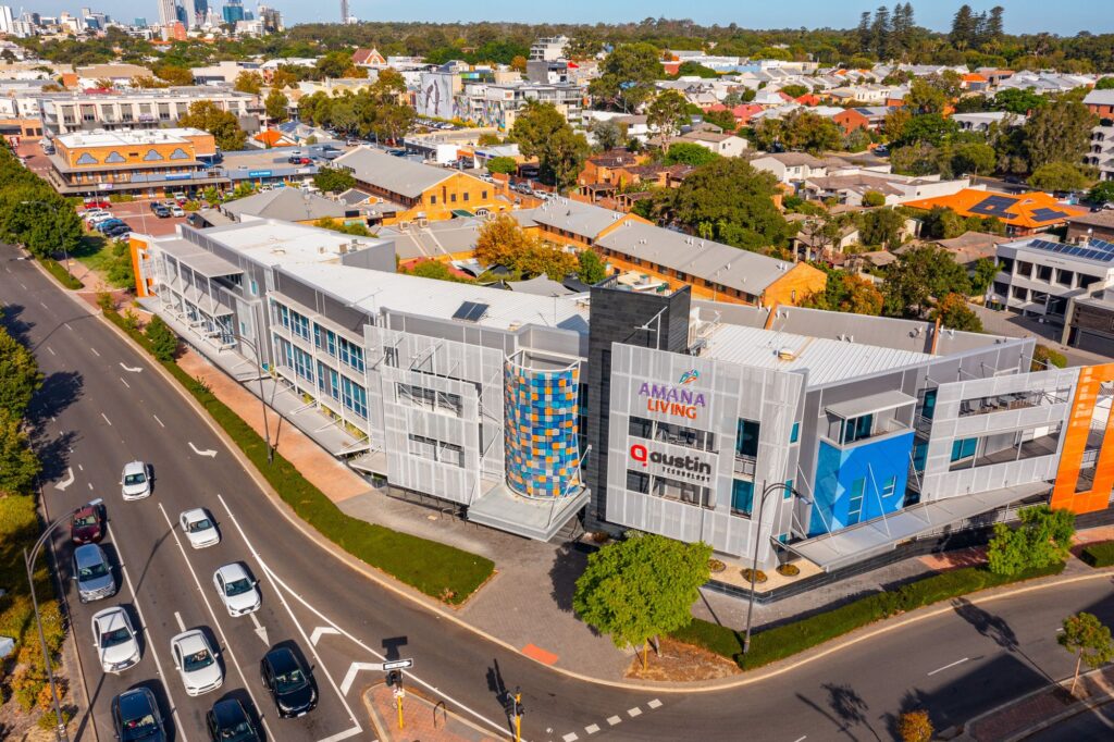 The Austin Technology office building at 541 Hay Street, Subiaco, with the Perth city skyline behind