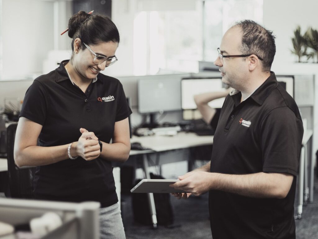 Austin Technology team members talking in the Subiaco office