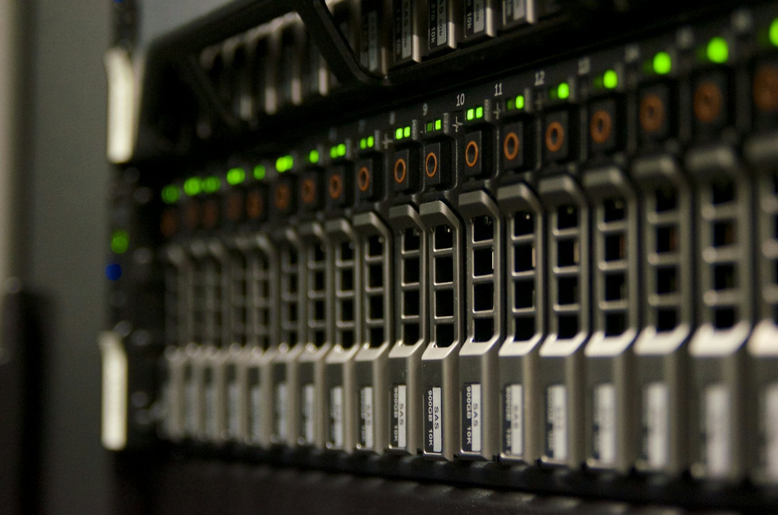 Server rack with rows of drives and status lights