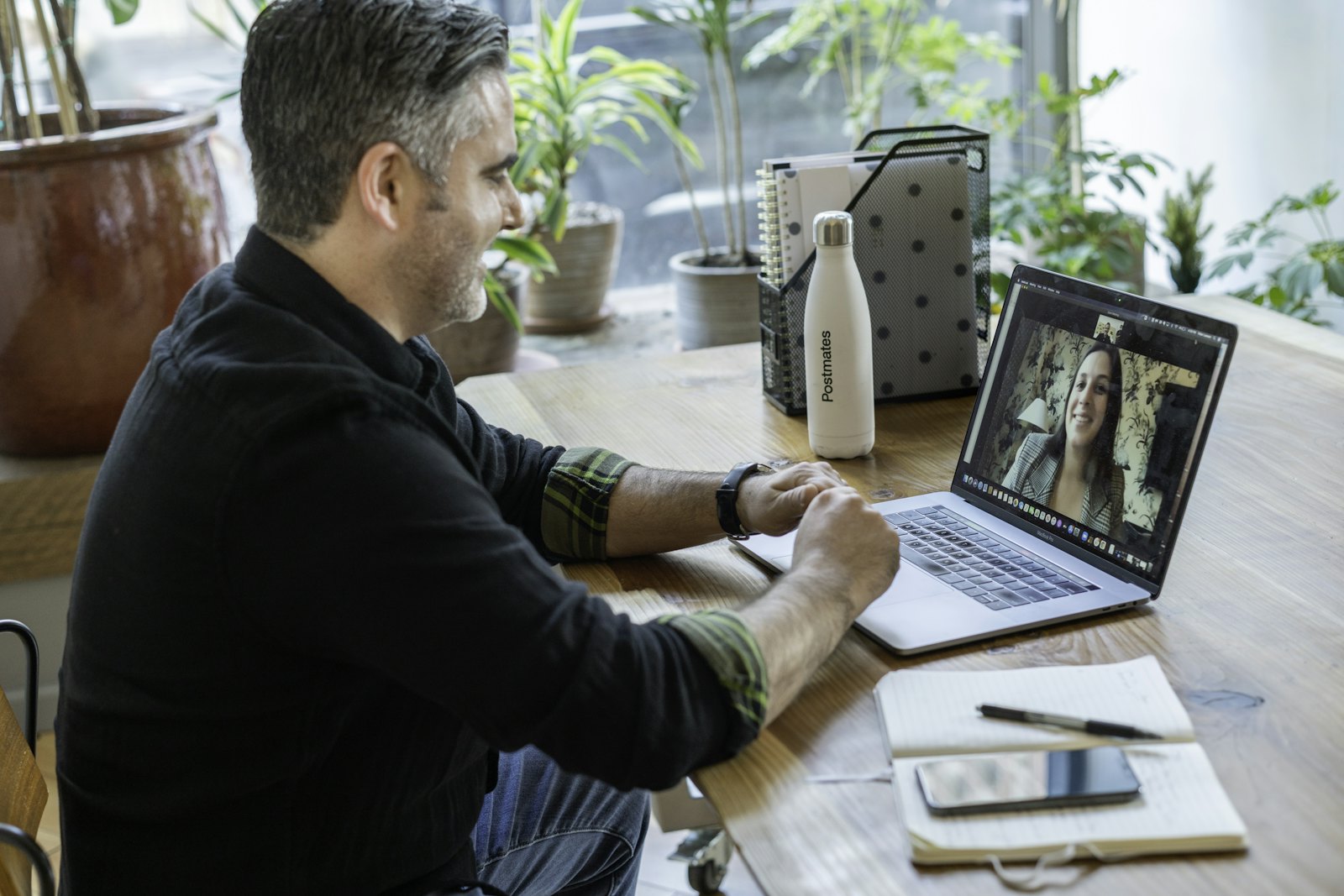 Man on a video call from a laptop at home