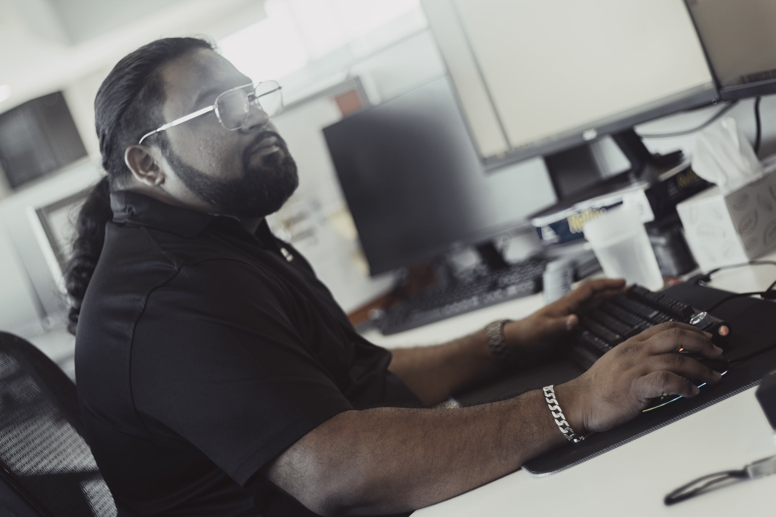 An Austin Technology security engineer working at his desk