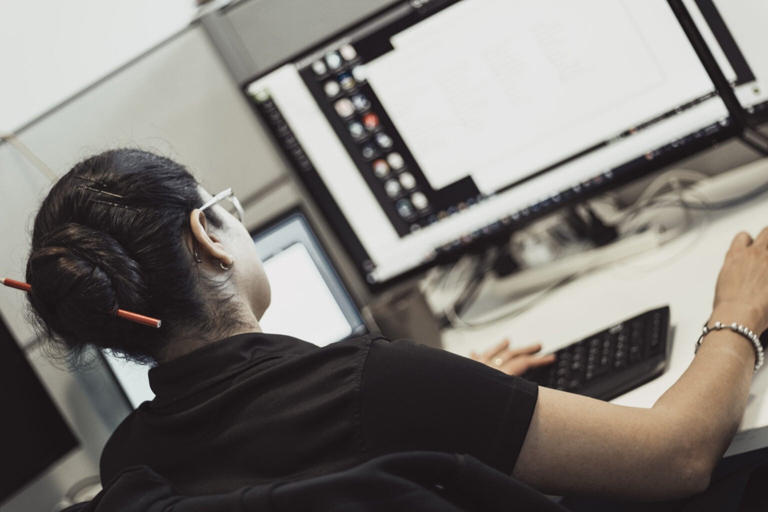 An Austin Technology engineer working through a recovery plan at her screens